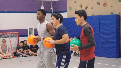 Sophomore Kenneth Onigbinde and seniors Peter Nino and Edwin Melgar prepare to defend their side of the court.