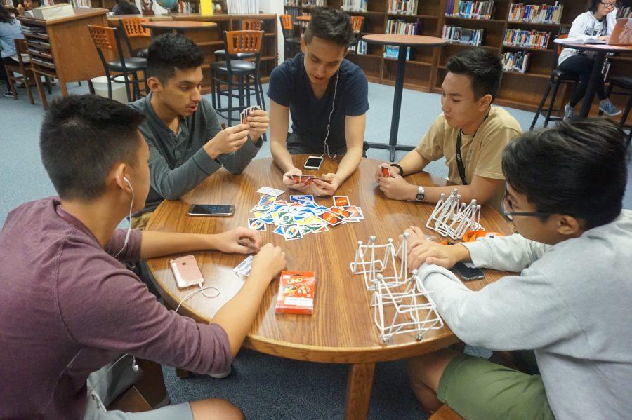 Left to Right: Justin Duong, Axel Soto, Jimmy Carter, Kevin Huynh and Tu Nguyen are seen playing a casual game of Uno.