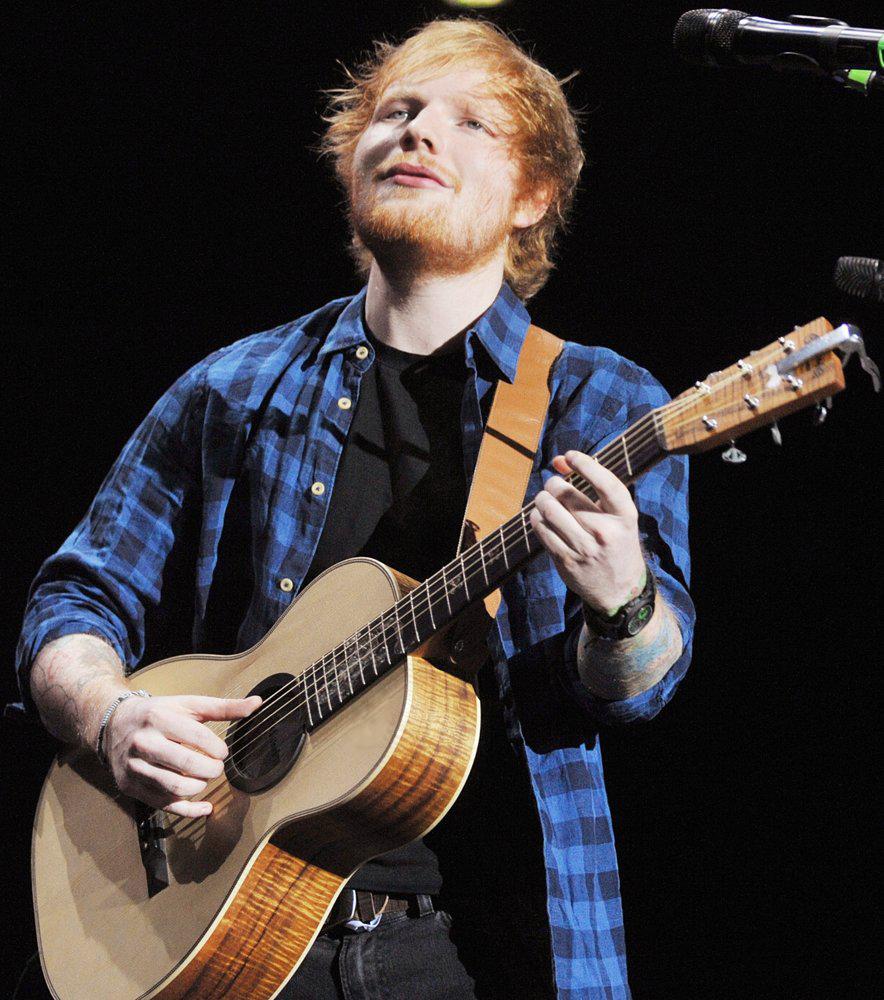 Music artist Ed Sheeran plays “Shape of You” at a live concert in New York. Photo Credit: James McCarthy