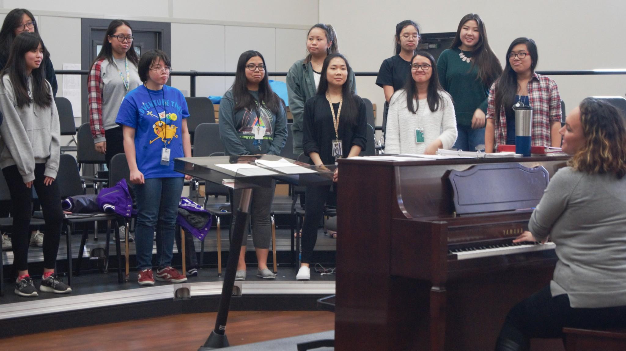 Ms. Winslow is working with her students to practice for their UIL songs Hello Girls by Pfaustch, Tota Pulchra Es by Durufle, and The Lake Isle of Innisfree by Daley.
