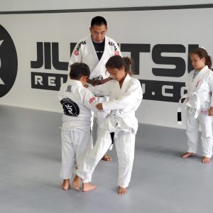 Moon Kim works with students at Reign Jiu-Jitsu in Katy.