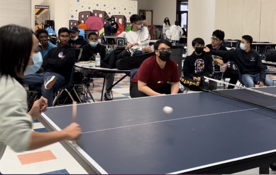Tommy Ly, sophomore, faces off against his opponent in a ping-pong game. They are one of the matches in the first elimination rounds. I feel happy actually doing something I enjoy, Ly said.