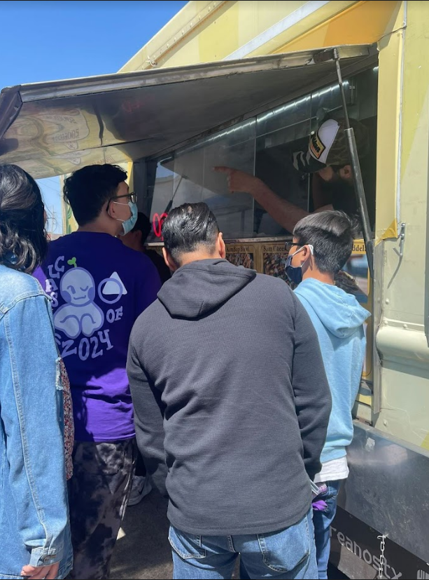 A student is ordering a meal from the food truck.
