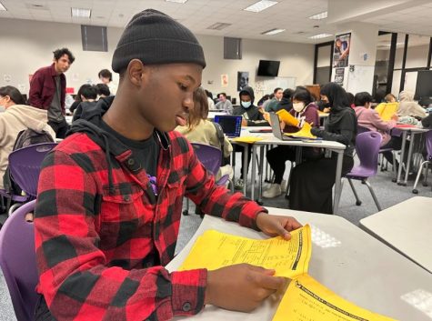 Usi Dapo is a Sophomore at Kerr Higschool. He is a very strong willed person when it comes to math. I really want to do well on this Quiz--hopefully it will bring my grade back up. Usi Dapo, in the math center, studying an Algebra 2 PAK before the quiz.
