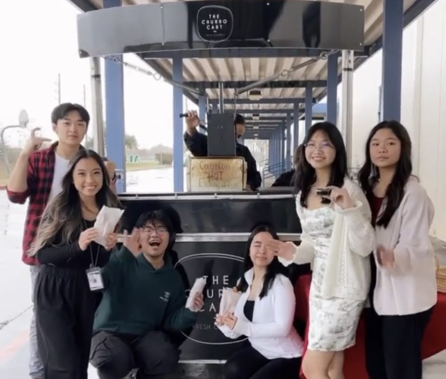 Sugar Rush: The Student Council Officers pose for a picture in front of the churro cart. 