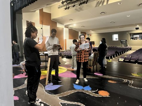 It’s A Set-Up: All UIL Cadre members start blocking for class play “Imaginary Invalid”. From left to right, junior and actress, Ianna Walker, and senior and actor, Masoud Said jots down their blocking on their scripts given to them by Director Julie Ryan. Picking up insights, Masoud states, “Overall, I feel like it’s a very fun play, different from what we normally do, so I’m ambitious and excited to start on it. [However I] can’t say we [referring to the members] are struggling [with the blocking process].
