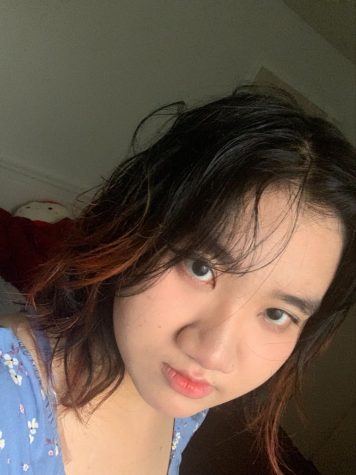 Quynh Ho in her room getting ready for school.