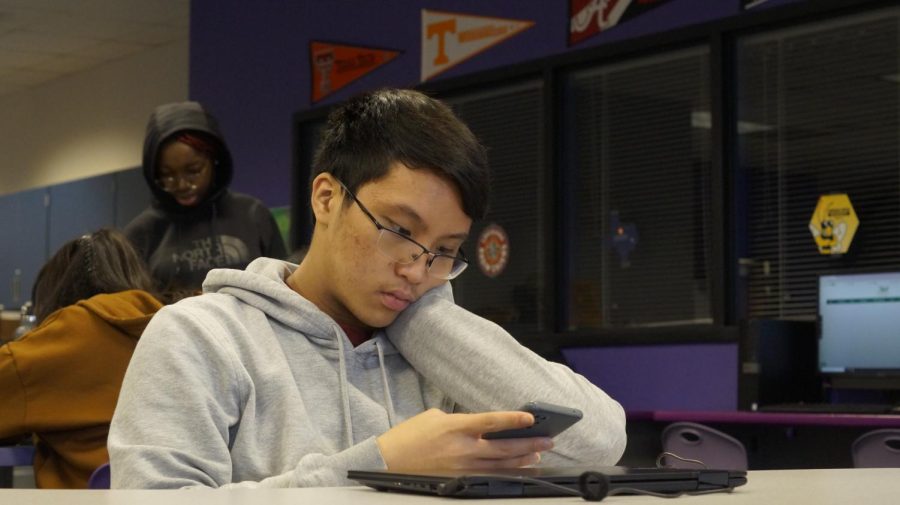Second Period Shenanigan: After Calculus BC, Tuan Le winds down during Study Hall by playing Yu Gi Oh! on his mobile phone. He said, Its quite complicated at times, but its fun. 