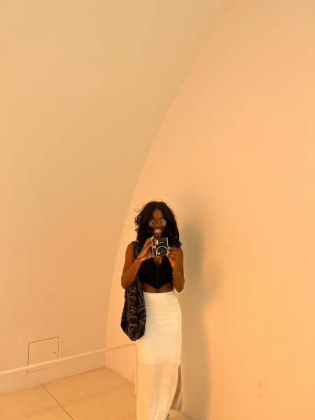 Favour Taiwo taking a photo in the Museum of Art. 