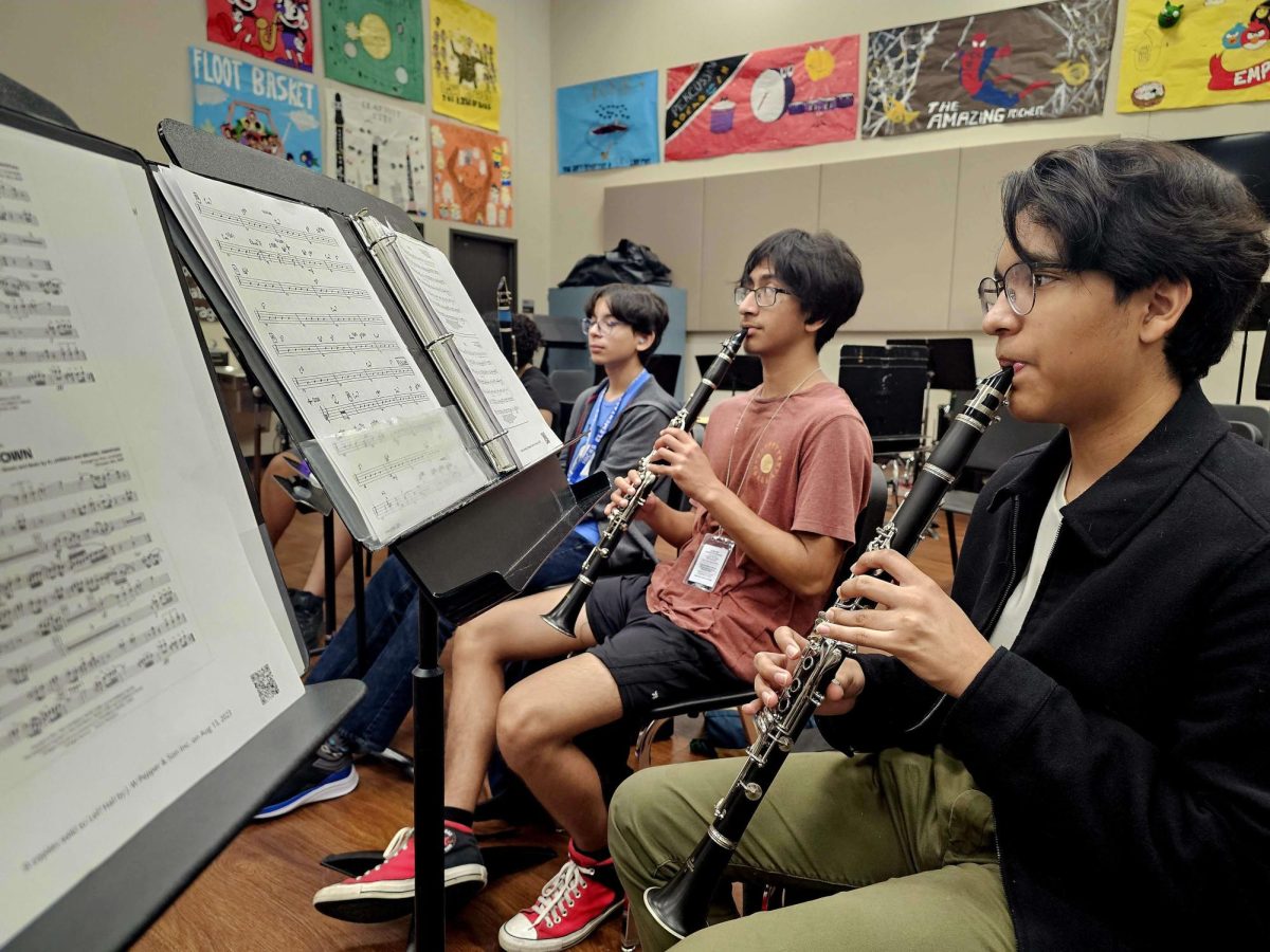 Achieving Brilliance: They sat together, trying to practice and memorize their pieces. Although it’s exhausting, it is still important, “Memorizing music is an essential foundation to our performance, band member Nifemi Oladesu said.

