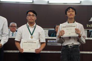Showcasing their achievement, Senior Tuan Le and Kevin Guo receiving their certificate of Board Recognition.