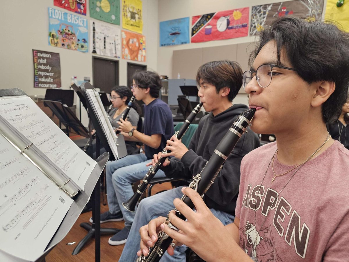 Kerr High School band students passionately bring the clarinet to life in the heart of the music room, their fingers dancing across the keys in perfect harmony. Viet La reflects, “We create a symphony of unity, where every instrument becomes a voice.” 