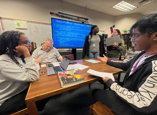 Game Faces On
Leah Ghebrulul, Raiyyan Khan, Shalom Akinkunmi, Victoria Pacheco, and Derek Davis write outlines for congressional speeches. They had a total of 14 speeches to prepare for the upcoming tournament. Congress is only fun if you come prepared, says Khan.