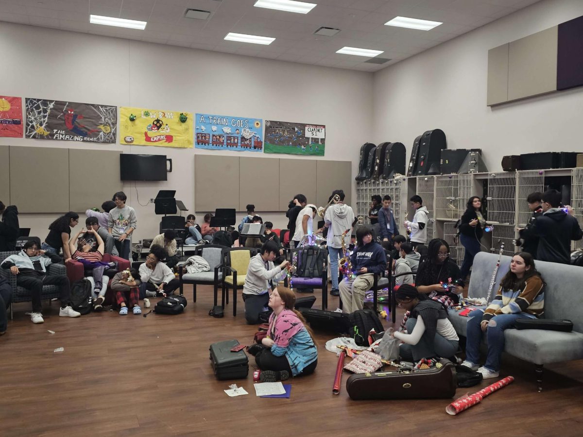 Band Students transform the room into a cheerful holiday symphony, wrapping up gifts and decorating the rooms. “We love to do what we can to lift up our spirits.” - Viet La
