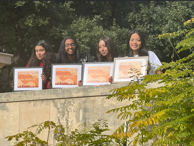 Walking On Sunshine
Erica Carranza, Sarah Abi Saab, Leah Ghebrelul, and Abigail Nguyen pose after winning their speaker awards for the UT Tournament. There were 42 teams present, constituting around 200 competitors. It was the perfect birthday gift, said Carranza.