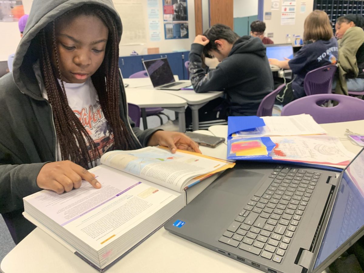 Studying Students 
As testing season is coming up, many courses have upcoming EOCs and finals. Seen in the picture, Rebecca Oyenyiyi is seen studying for an upcoming EOC. I need to review for the information to settle in my brain, Oyenyiyi said. 