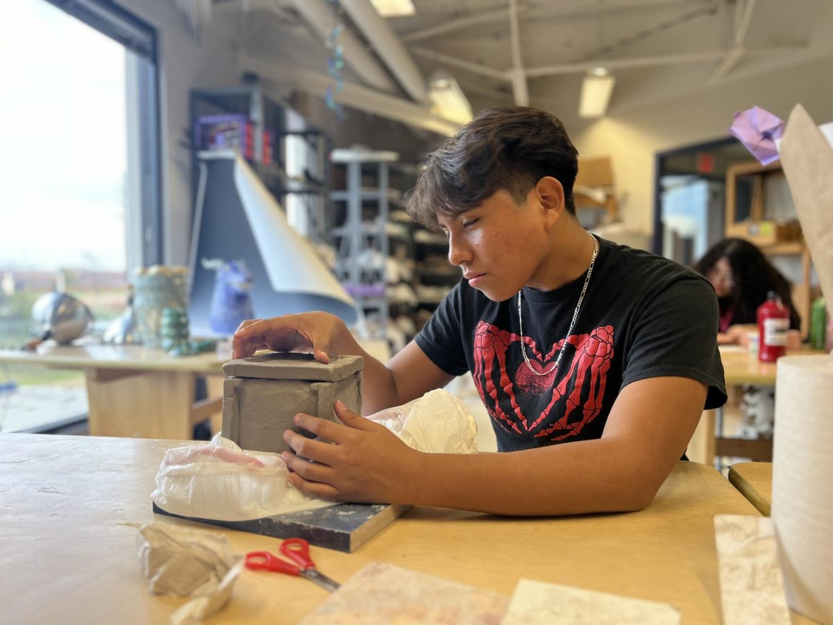 Victor+Dominguez%2C+a+sophomore+at+Kerr+High+School%2C+was+working+on+his+Art+III+Ceramic+II+project.+%E2%80%9CIt%E2%80%99s+fallen+two+times+now%2C+but+I+aint+giving+up.%E2%80%9D+said+Dominguez