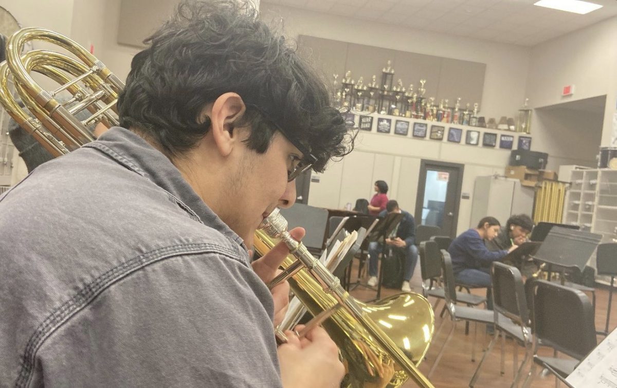In the band room at Kerr High School, committed students are hard at work improving their compositions. During a focused practice, Raiyyan Khan says, We practice hard, making every note count towards our big performance.

