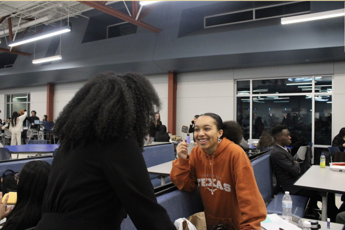 Endless Smiles
Leah Ghebrelul and Nyla Whiteside congratulate each other after a long day of debate at the Ross Sterling Tournament. With city qualifiers coming up, this competition was great practice. I had a lot of fun, said Whiteside.