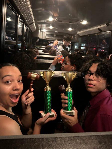 Nyla Whiteside and Sean MClain celebrate their victory at City Qualifiers on the bus ride back to Elsik. They used this tournament as practice for Congress UIL. Its good to know that I am one of the best, said McClain.