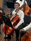 Playing Away
Junior Victor Nguyen poses for an Orchestra photo following his Winter Concert. This is his third year as a cellist in Cambiata Orchestra. I love playing music, and cello is a lot of fun for me, Nguyen said.
