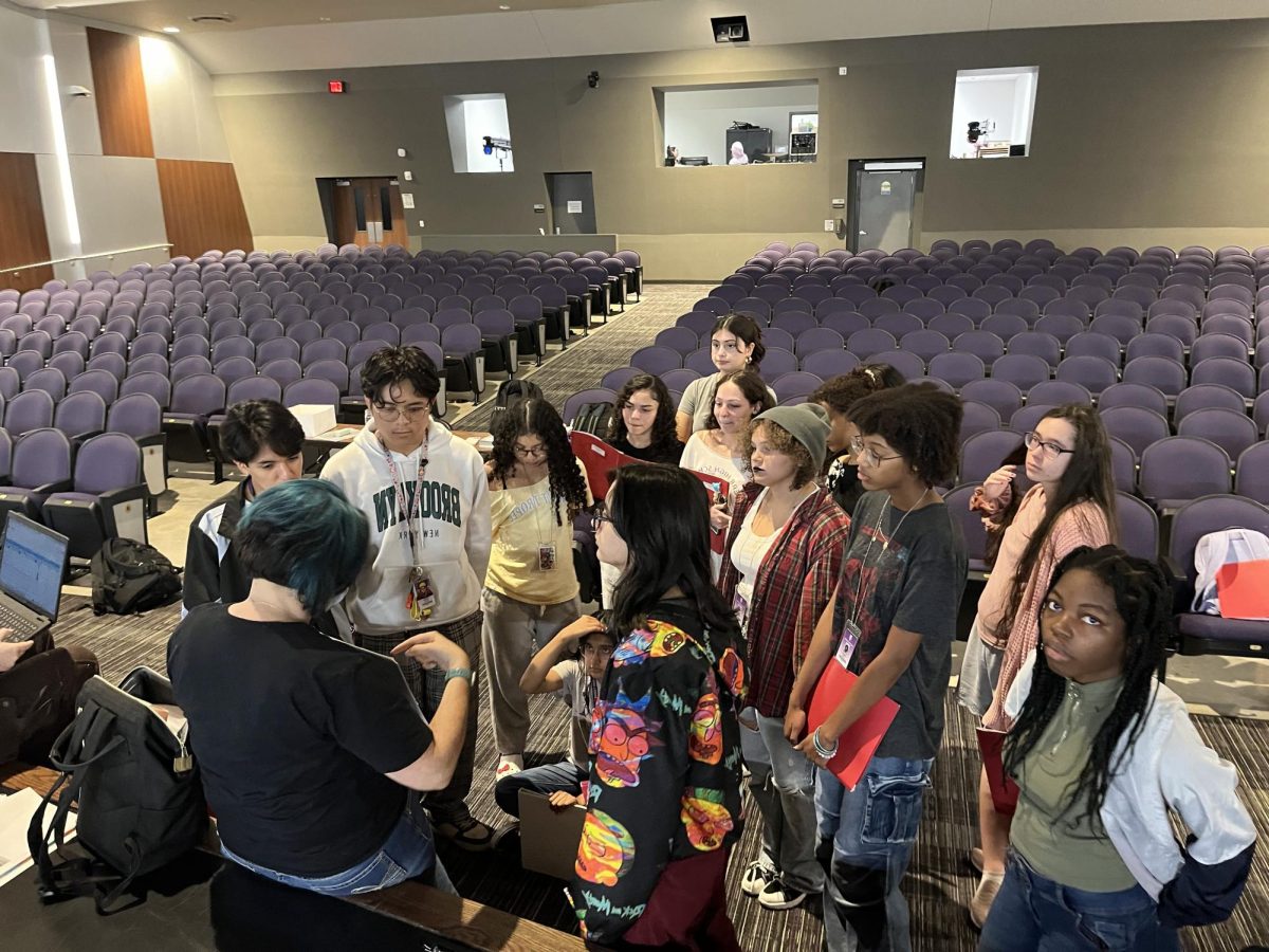 All Eyes On Us
Moises Zuniga, Wilson Nguyen, Natalia Sorto, Ashlyn Yencle, Guerlin Yencle, Camila Haro, Josey Adams, Safa Karim, Erica Carranza, and others gather around Mrs. Ryan toward the end of their first rehearsal. Seeing as this is the first show of the school year, the stakes are extremely high for all students. "I'm very excited to see how this goes," Carranza said.