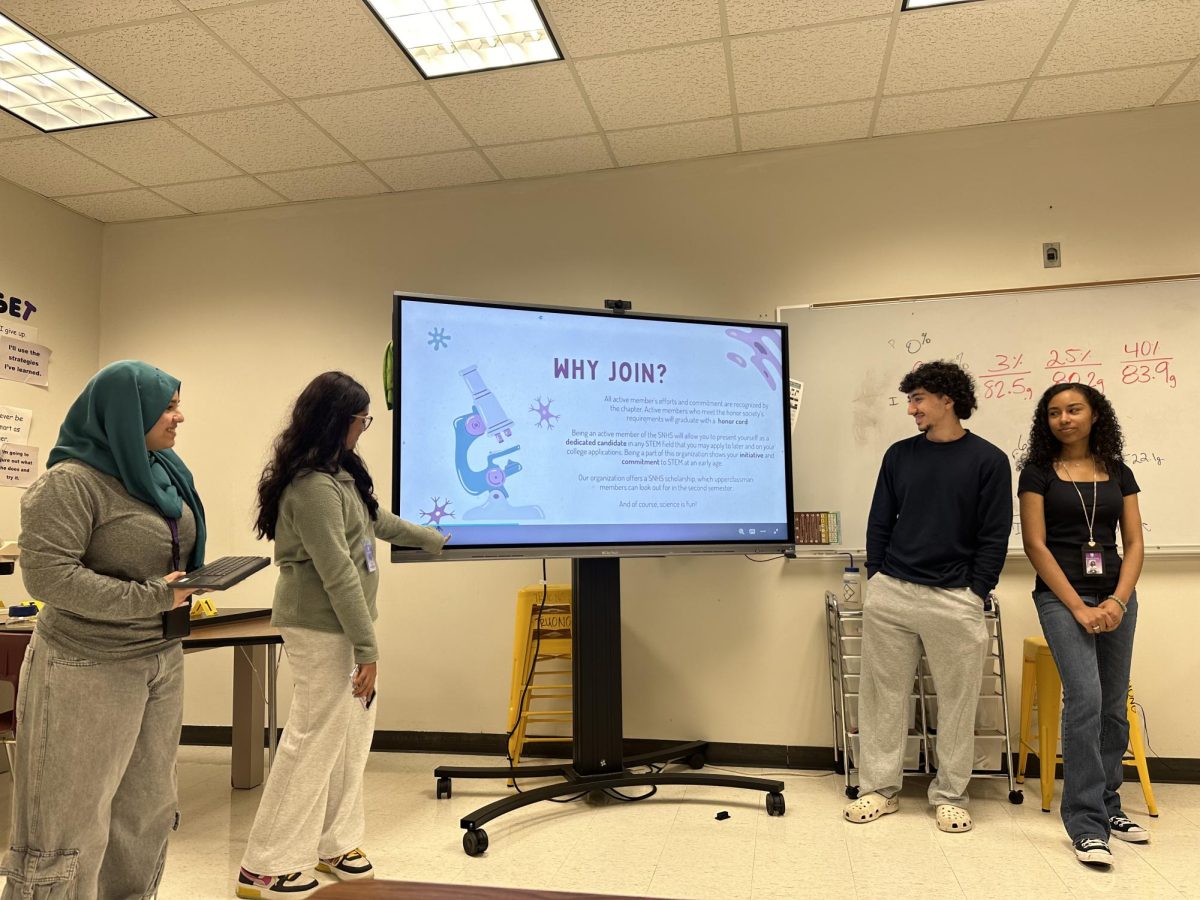 Kicking Off the Year! 
SNHS officers Alisha Rahman, Manar Al Ghburi, Aryan Shoei, and L’oréal Long present information at their first general meeting. The basics were introduced for new members interested in the club. “SNHS gives you the opportunity to showcase your love for science in your resume, so join today,”    Rahman said. 