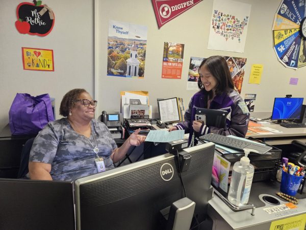 A Trip For A Tip: Senior Jenny Nguyen hands back her permission form to College center paraprofessional Ruthie Griffins. After receiving the form, another form needs to be completed online through a QR code before shes good to go. “The online form is long but it should give us an idea of how many are going,”  Griffins said.
