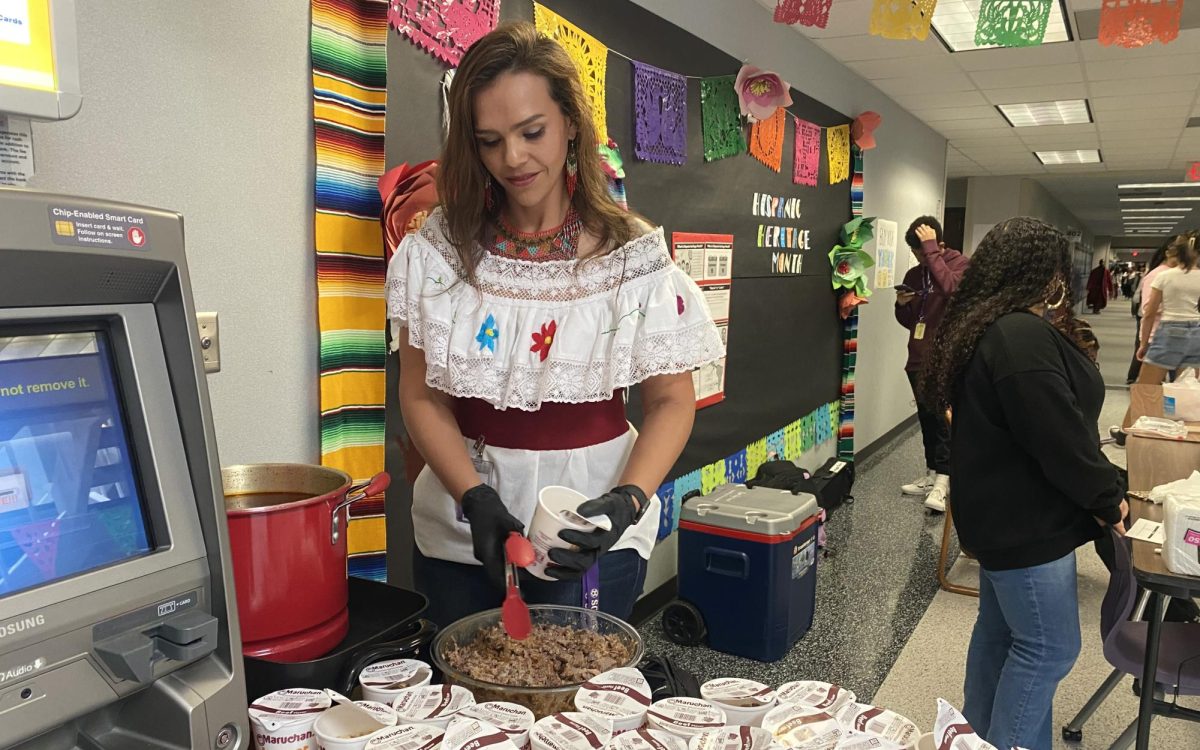 Getting A Taste of Culture: Latinx Association sponsor, Karen Orta, prepares Birria ramen orders. She brought and arranged all the materials for students to enjoy. “Filling out the orders was hectic but fun at the same time,” said Orta.
