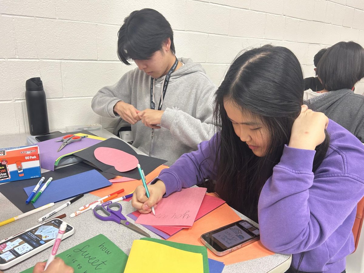 KeyClubbers: Tiana Luong and Ryan Nguyen craft personalized teacher appreciation cards. They're using this opportunity to not only express gratitude but also earn volunteer hours for this month's general meeting. "I'm aiming to create six cards to earn three hours," Luong said.