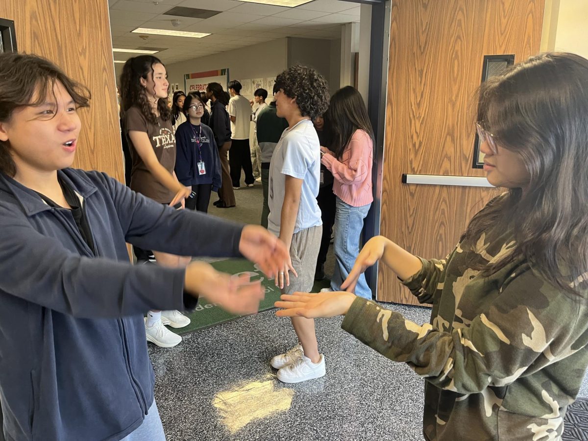 It's time to shine. Freshman Dat Nguyen and sophomore Katlyn Khuu practice their chorography as they wait for their turn. They will be performing Espresso by Sabrina Carpenter. "I'm scared of forgetting my dance last second," said Nguyen. 