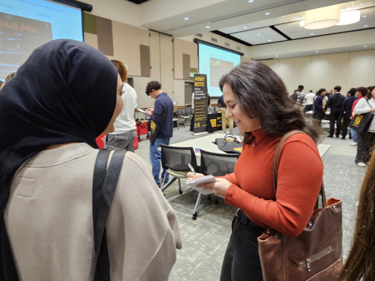 Geared Up: News reporter Brooke Kushwaha interviews Senior Iqra Naveed. Kushwaha asks questions about Naveed’s college application and what she is deciding to do after high school. “I wasn’t expecting anyone to interview me at the event, but it was fun,” Naveed said.
