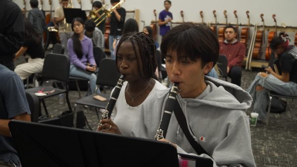 Perfecting the Notes: Clarinet players Ifetayo Taiwo and Taylor Nguyen  practice ahead of their Honor Band auditions. They dedicated hours of preparation on their clarinet pieces to ensure their performances stood out. “It’s an intense process, but I think it’s worth it to make it,” Taiwo said.
