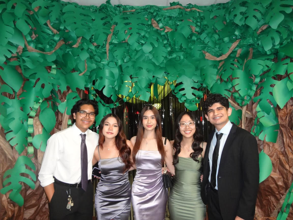 Endless Smiles
Adrian Alas, Emmi Truong, Jessica Nguyen, Nhi Le, and Luis Renteria pose for a picture at the entrance on the night of Homecoming. This being their last Hoco as graduating seniors, they were excited to see what STUCO had in store. "They really outdid themselves with the decorations this year," Alas said. "Really transports you into a new place."