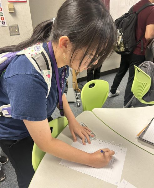 Sign Up! Khavian Nguyen signs in at Mu Alpha Theta’s third meeting of the year. She was eager to learn more about next week’s induction event. "I love math—it’s something I even do for fun in my free time," Nguyen said.