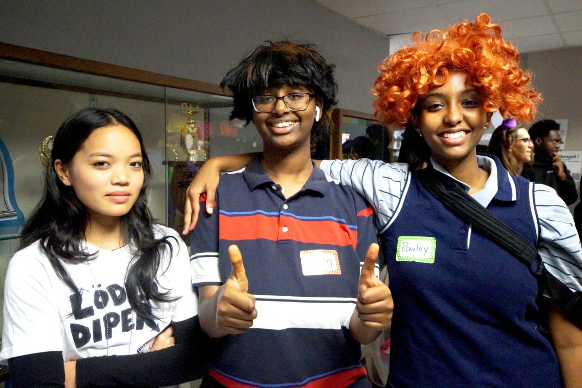 This is Halloween! Abigail Nguyen, Amen Moreda, and Leah Ghebrelul dress up for library contest. They portrayed characters from the Diary of a Wimpy Kid movie. "This wig is nappy,"  Ghebrelul said.   