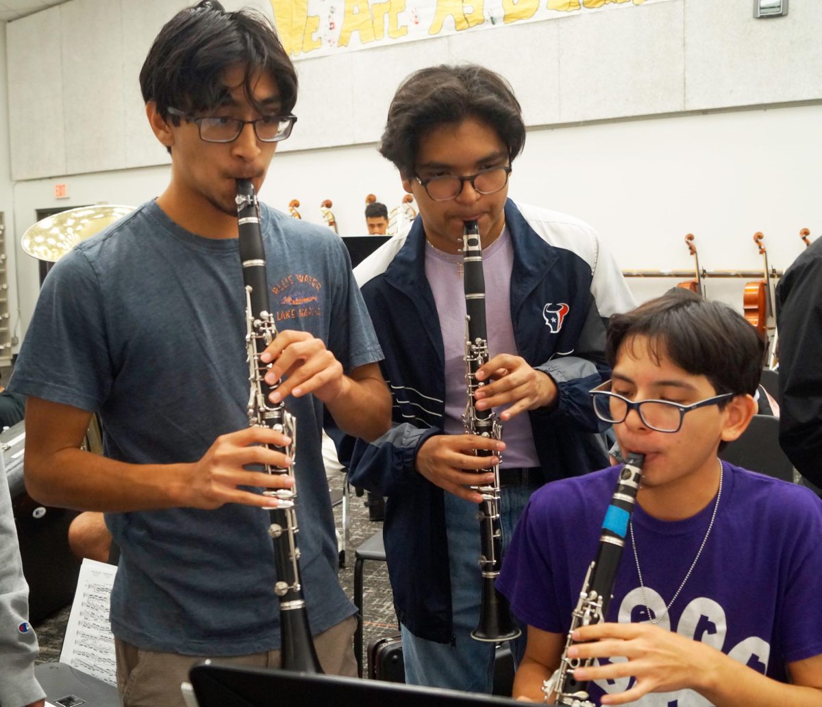 Finding Harmony. Diego Acosta, Adrian Alas, and Esai Alvear Moreno practice together with their clarinets. They played the music on the sheet until tryouts began. “It’s fun to get different perspectives,” Moreno said. 