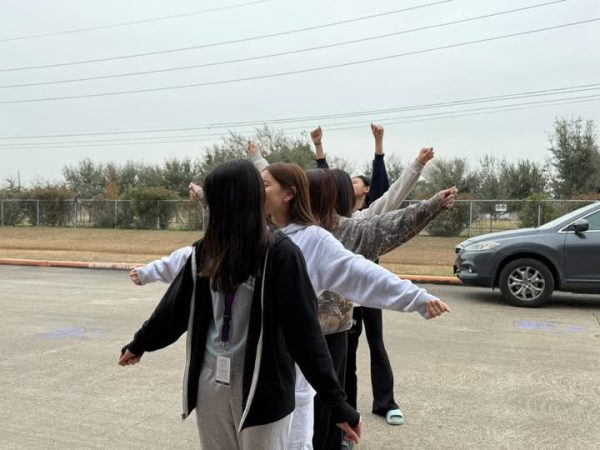 In formation! Vanna Do, Haley Ngo, Brittanee Giang, Cindy Pham, and Eliana Dinh practice dance routine. Do led the group, staying in sync with the music. "I started to get the hang of it as we went along," Do said.