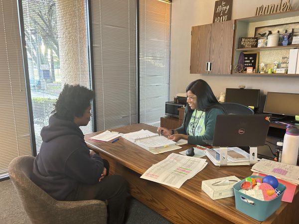 Senior Year Preparation! Sherry Iyamu helps Joshua Salu plan his senior year schedule. She emphasizes the importance of completing his final core classes to graduate on time. "We're approaching the home stretch now," Iyamu said.