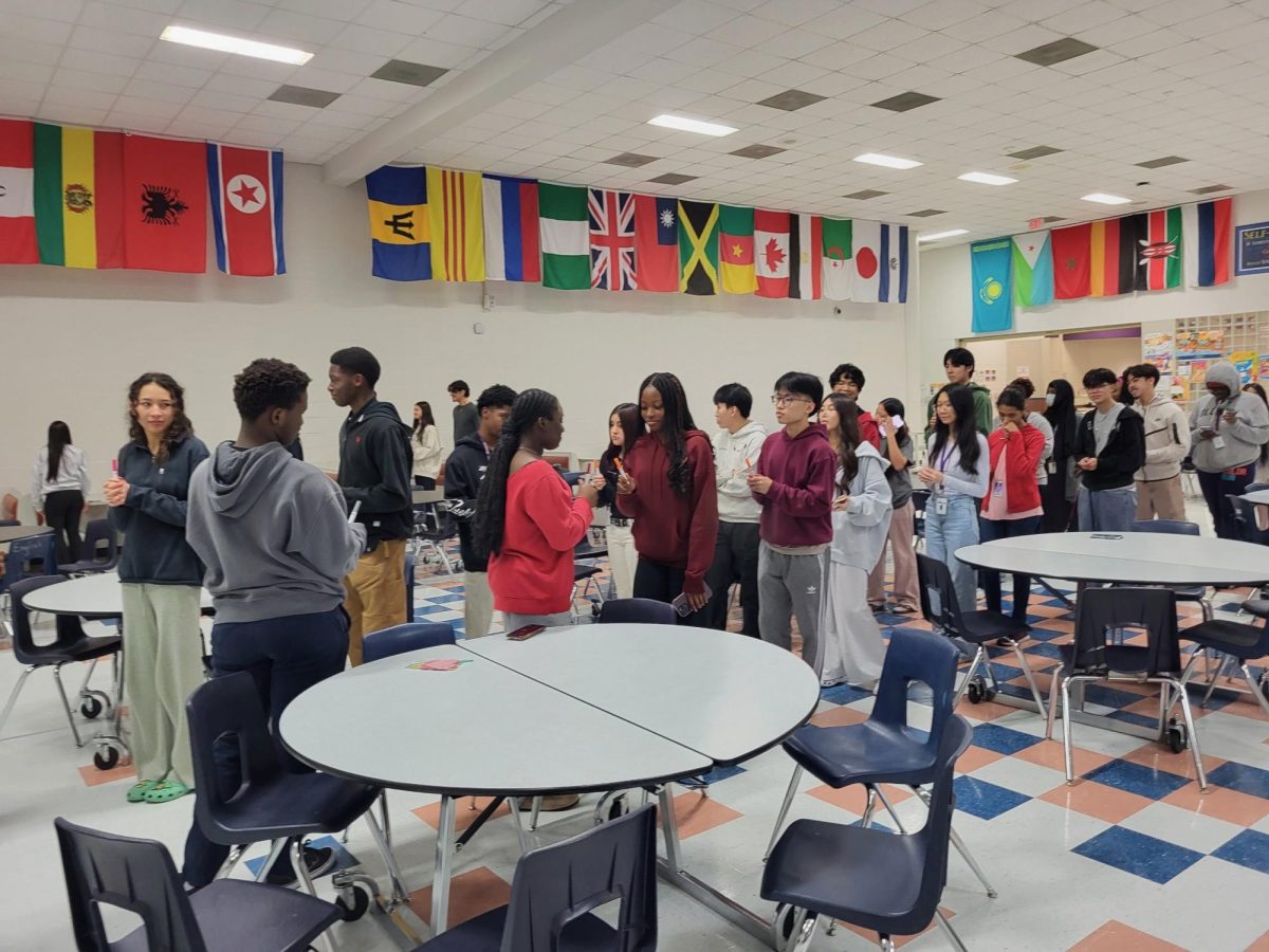 A Successful Rehearsal: NHS inductees practiced for their upcoming induction ceremony after school in the cafeteria. They were provided with markers to represent the candles. "I can't wait for the induction ceremony," Olivia Nguyen said.