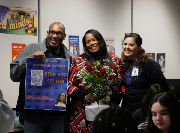 Celebrating Smiles. Assistant Principal Christopher Perkins, Science Teacher Meredith Freeman, and Principal Sara Tones pose for photo. Perkins and Tones worked together to orchestrate the surprise. "Thank you everyone," Freeman said. 