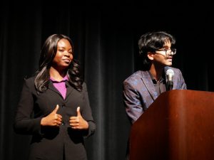 A Wonderful Speech: NHS officers Rebecca Oyeniyi and Muhammad Annas speak at the induction ceremony. They waited to start calling names and pass out the candles. "It went by really fast," Oyeniyi said.