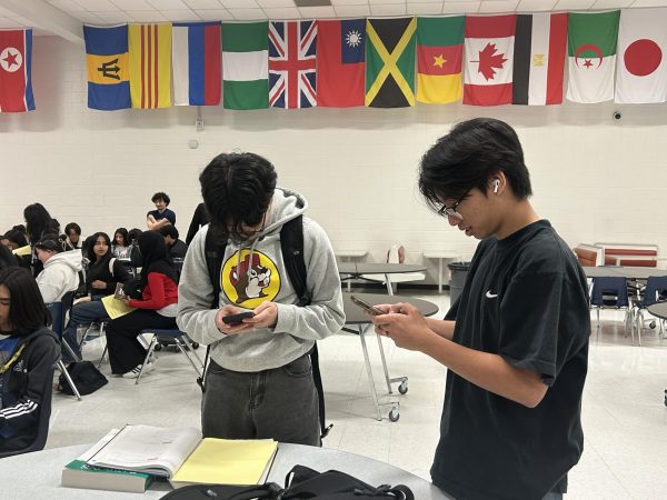 Heads in the Kahoots! Dylan Nguyen and Alexander Nguyen plan an intense Kahoot battle with their NTLB group. They worked together in the February mixer. "The February Kahoot game was very fun this time around," Nguyen said. 