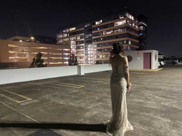 Pose for the camera! Beyonce Vallecillo takes post-prom photos at City Center. She chose the rooftop as a scenic backdrop to capture lasting prom memories. “I had so much fun getting ready and taking prom pictures,” Vallecillo said.