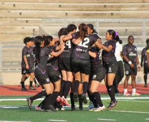 Celebration Time! Girls soccer team celebrates win. They finished the game around 6:20 pm. 