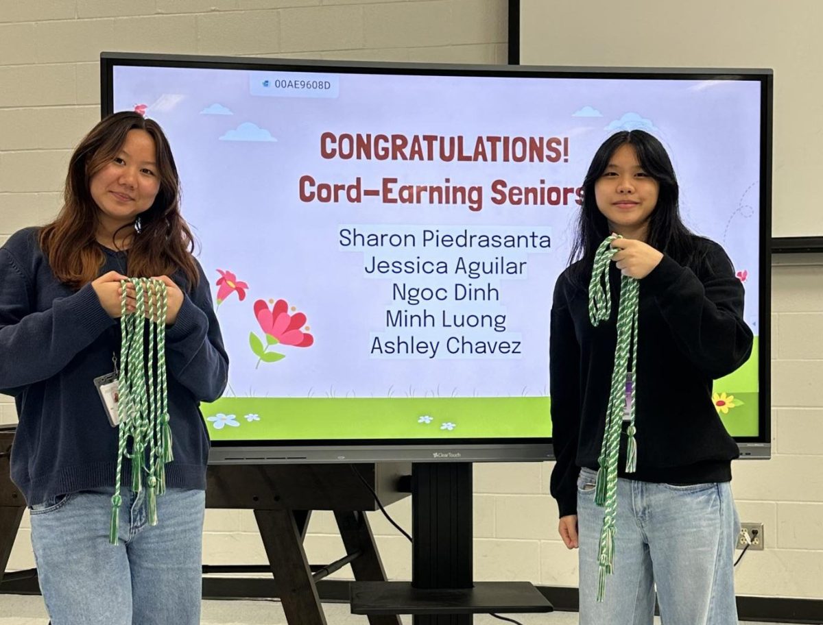 Stay on the know: Officers Helin Wang and Regina Tan gave out cords to seniors who qualified for a graduation cord. There were changes made to the cord requirements, with less activities required. "Make sure to wear it at graduation," Wang said.