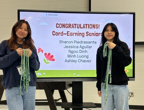 Stay on the know: Officers Helin Wang and Regina Tan gave out cords to seniors who qualified for a graduation cord. There were changes made to the cord requirements, with less activities required. "Make sure to wear it at graduation," Wang said.