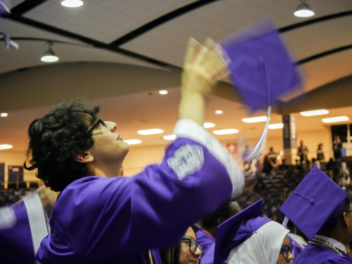  Rogelio Aguilar throws his cap into the air.