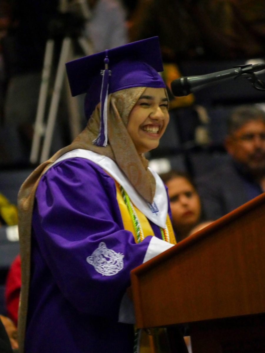 Valedictorian Manar Al-Gburi laughs about a bet with her brother. 