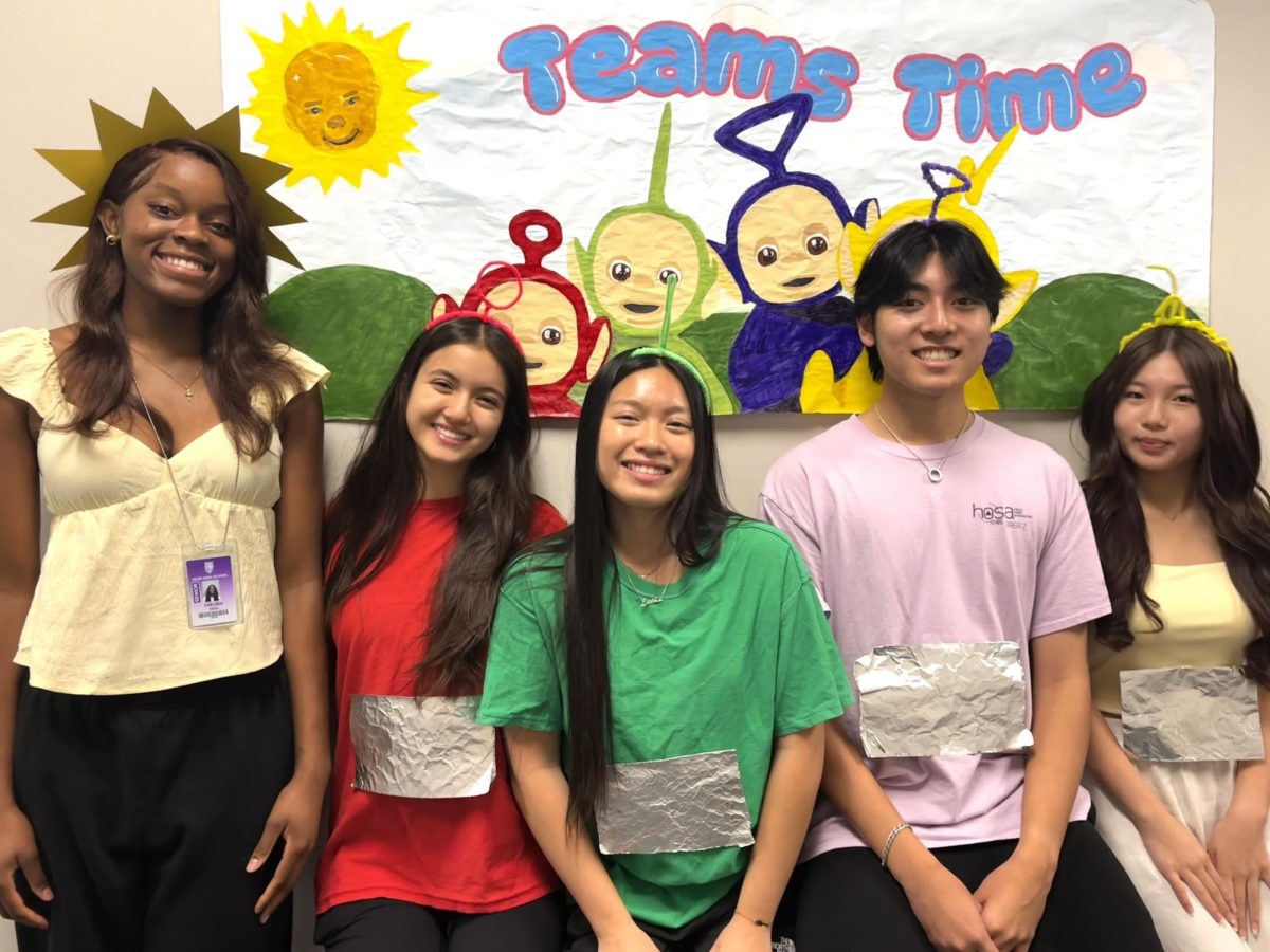 The Teletubby Network:  Seniors Chelsea Eboh , Janet Duong, Lisa Lee, Chloe Roberts, and Ryan Nguyen, dressed up as Teletubbies for Senior Week: Teams Time. They also took photos with their own digital camera. "There are only 4 Teletubbies but 5 officers and they all chose their Teletubbies color before I could read the group chat and choose mine. Since I was the only one without a color, we had the funny idea that I should dress up as the sun," Eboh said.